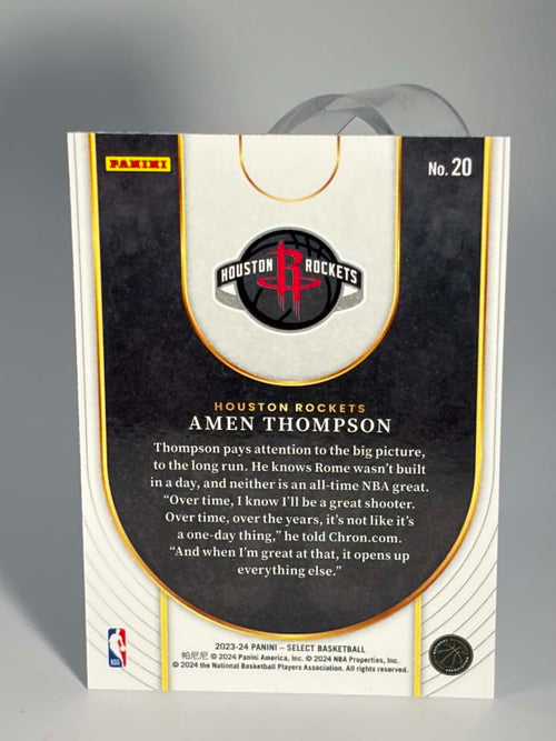 Basketball trading card packaging for Houston Rockets player Amen Thompson with team logo and text.