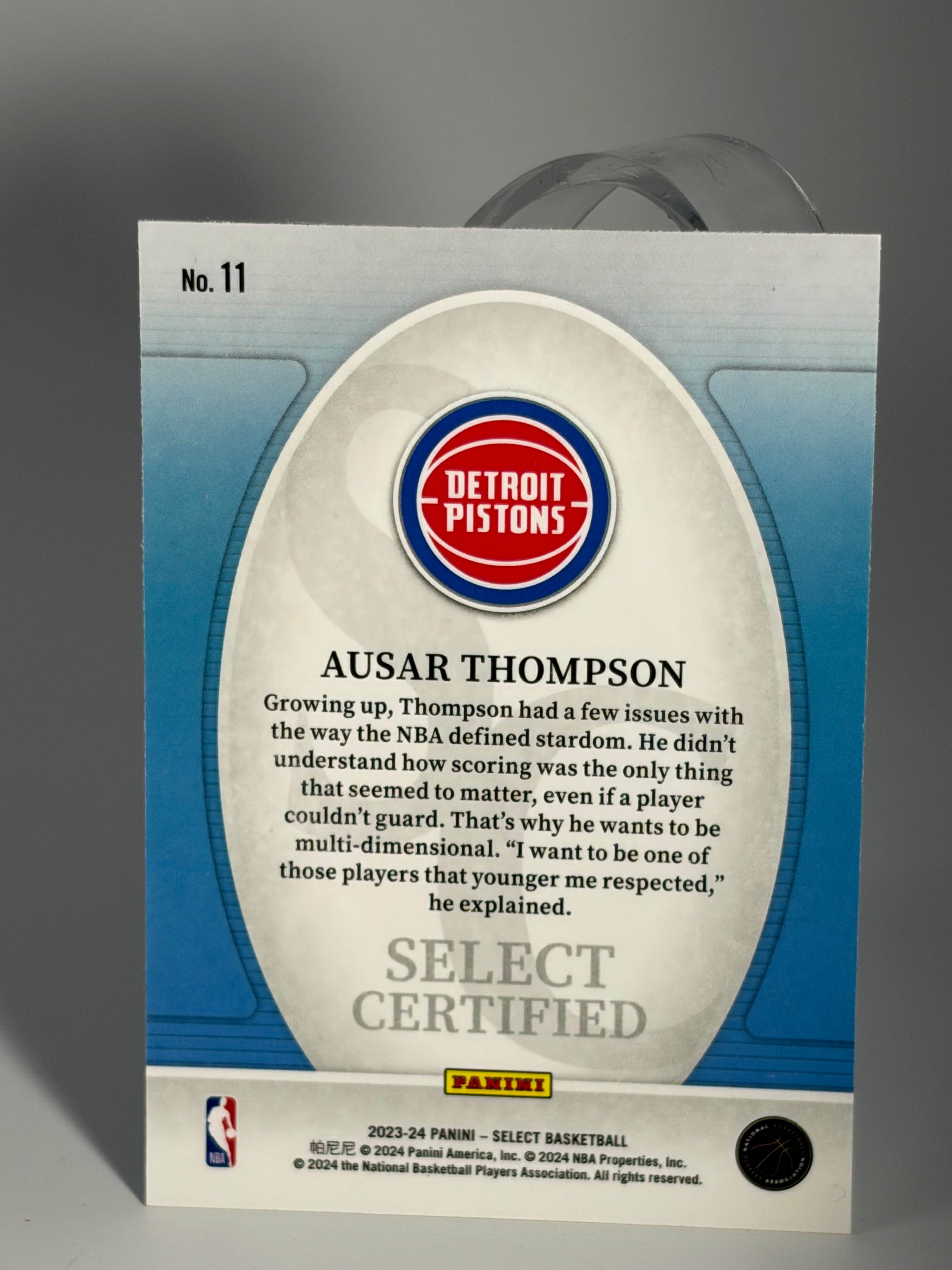 Baseball card with Detroit Pistons logo and text on a gray background