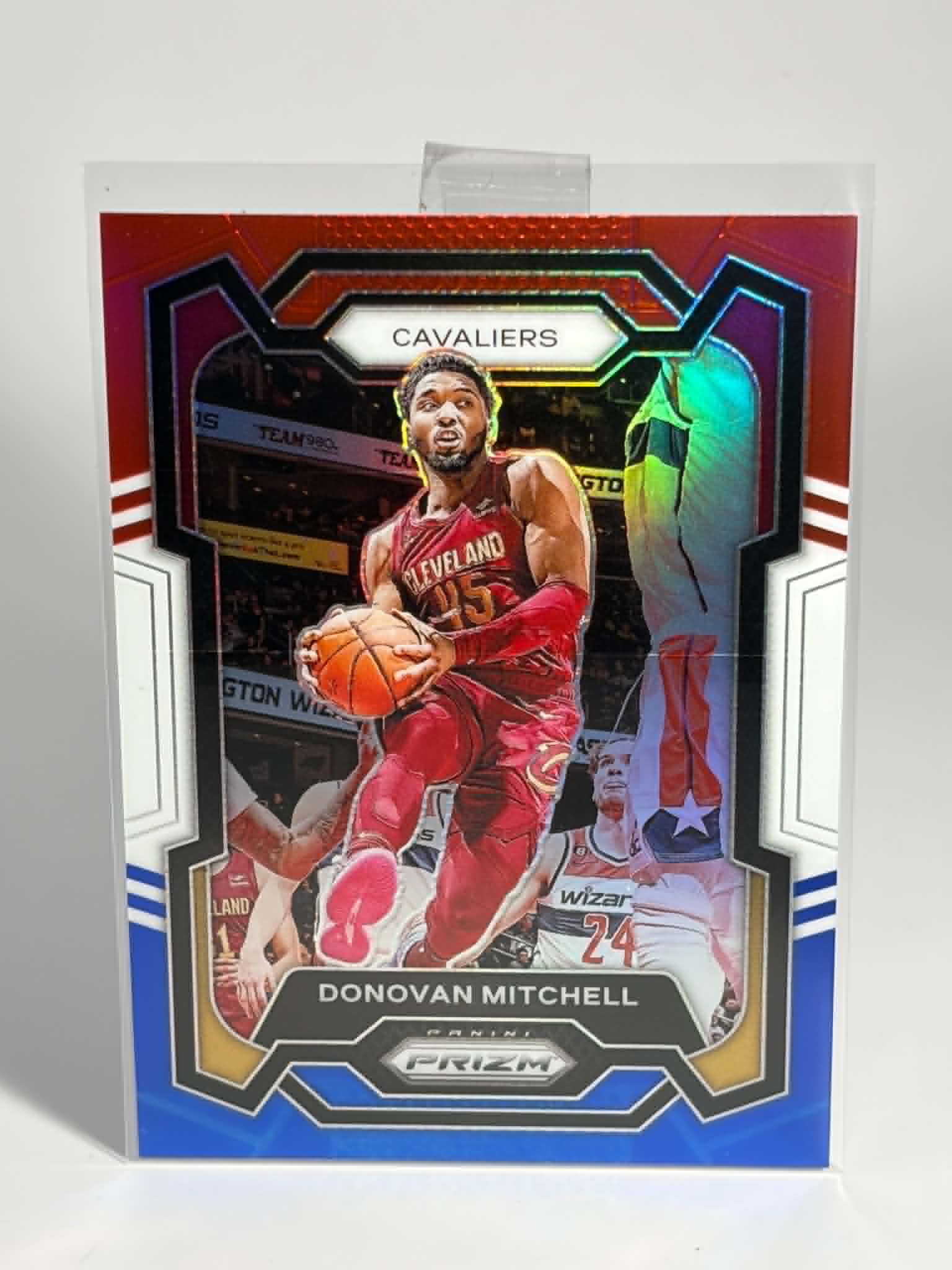 Basketball trading card of Donovan Mitchell with colorful border and 'Cavaliers' branding.