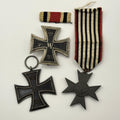 Three military medals with ribbons on a white background