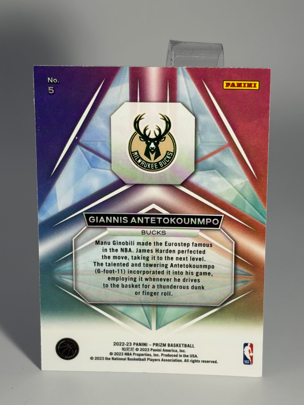 Basketball trading card with a player's name and number on a gray background