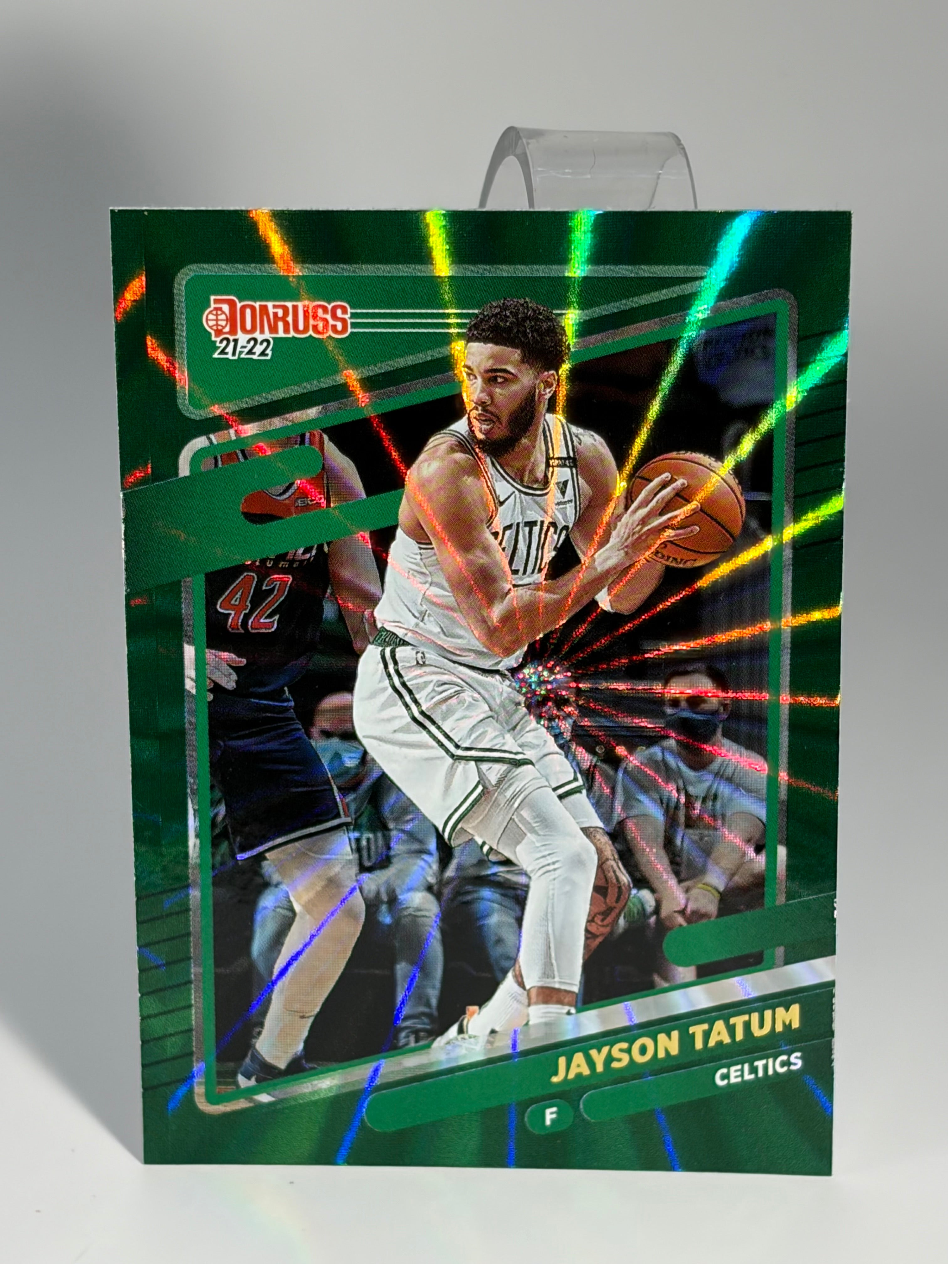 Basketball trading card of a player in action with colorful background