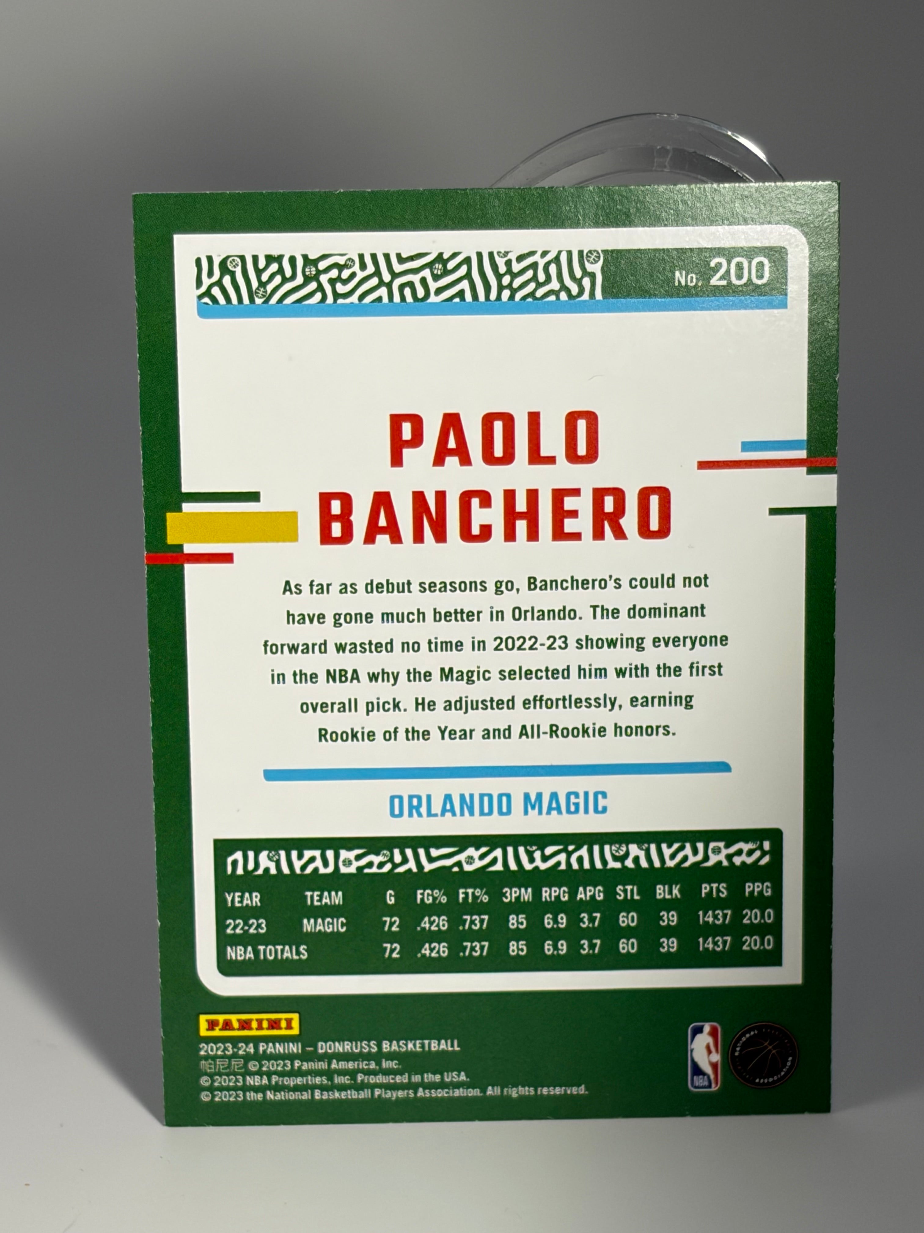 Baseball card of Paolo Banchero with player information on a gray background