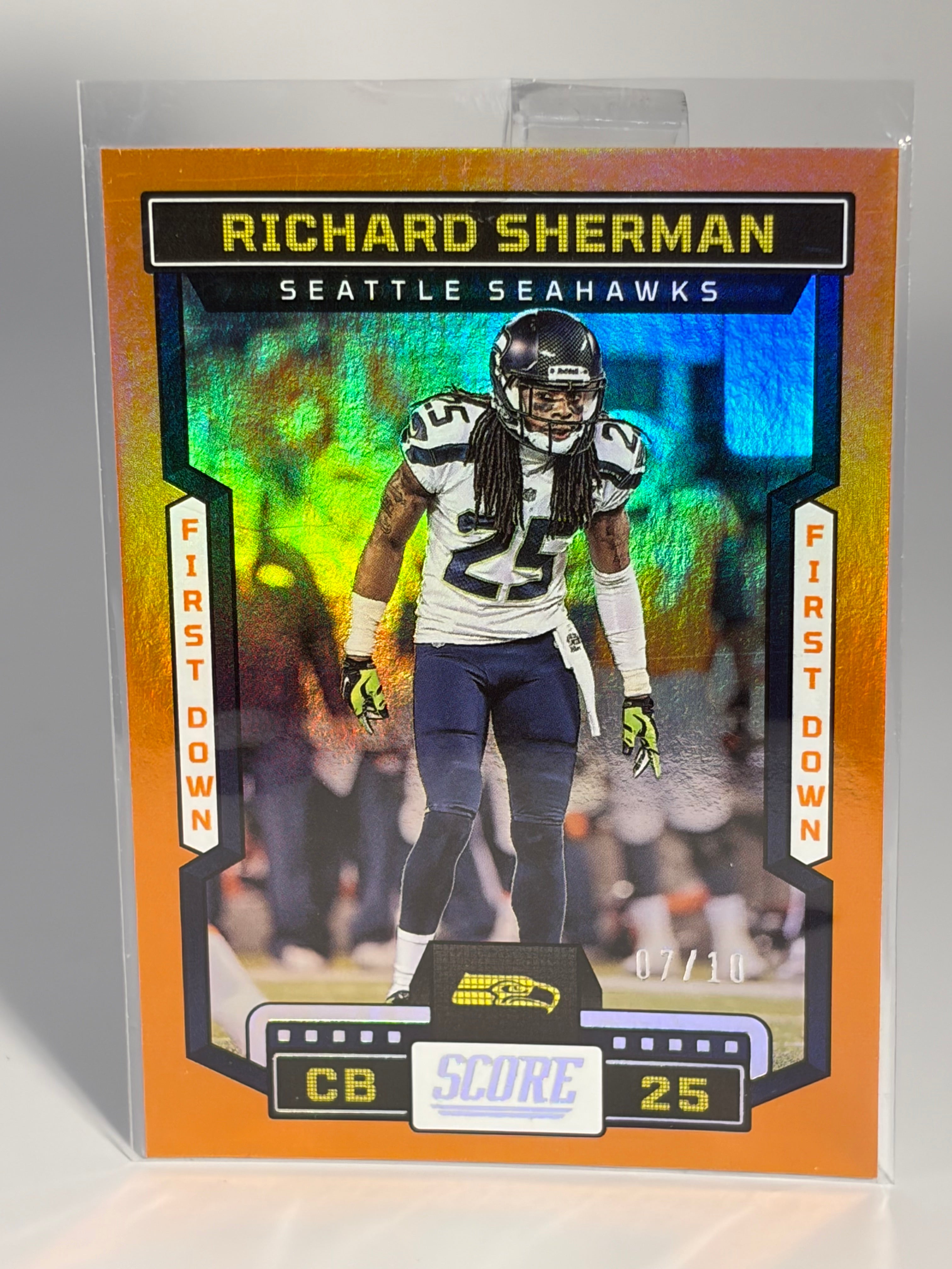 Football trading card of Richard Sherman with colorful design on a gray background