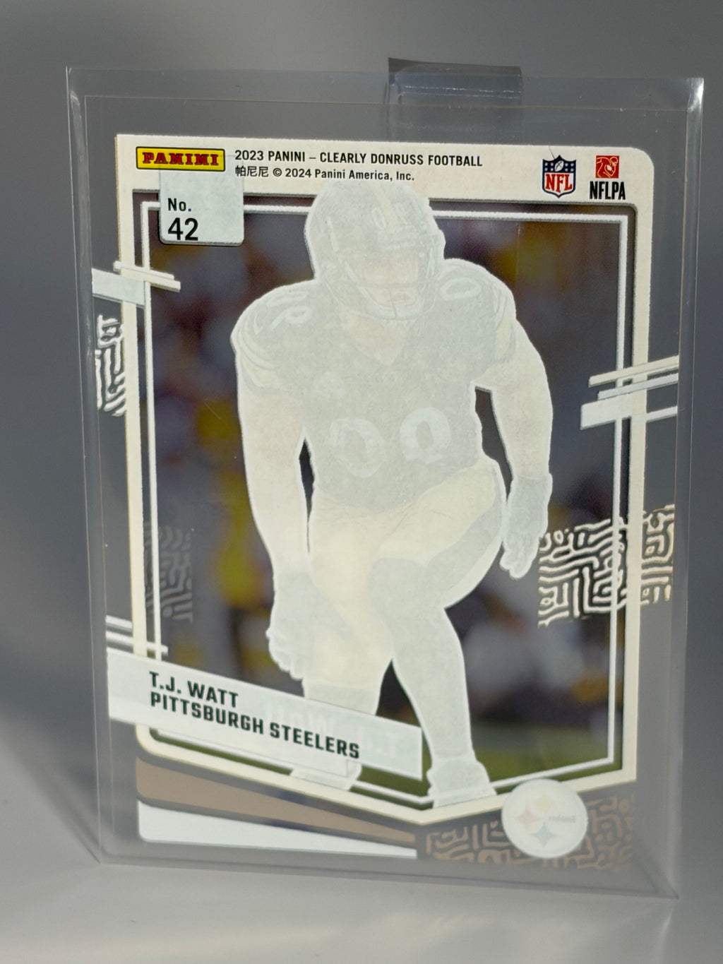 Trading card of a football player in a clear protective sleeve
